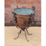 A late Victorian copper and wrought iron coal bucket, modelled with two lion masks and scrolls,