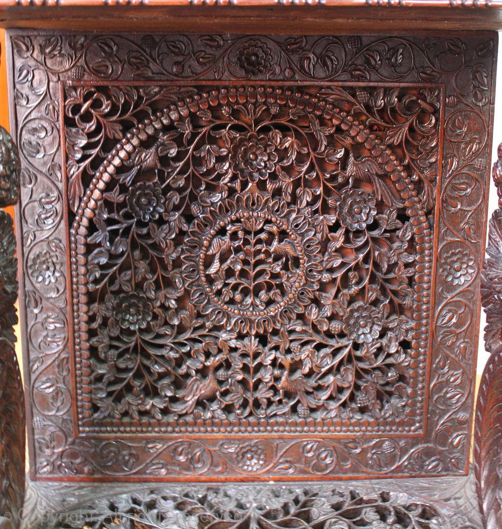 A late 19th century Anglo Indian / Burmese carved hardwood Davenport, - Image 5 of 9