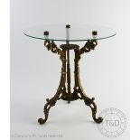 A Continental cast brass occasional table, with circular glass top,