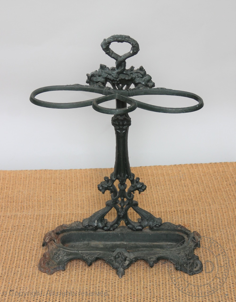 A Coalbrookdale style cast iron stick stand, with vine leaf detailing,