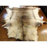 Two reindeer skin fur rugs / throws