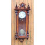 A walnut and stained beech twin weight Vienna regulator wall clock,