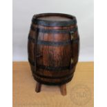 A cooped oak ale barrel, converted to a drinks cupboard,