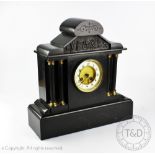 A Victorian marble eight day mantel clock of portico form, with movement stiking on a bell,