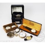 A Timex wristwatch in original box, an Omega open face pocket watch in gold plated case,