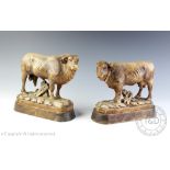 A pair of Black Forest type carved softwood figures of a bull and cow,