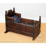 An 18th century oak cradle,