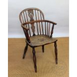 A 19th century yew wood and ash Windsor type chair, with hoop back and solid seat,