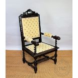 A Victorian carved oak hall chair, of 17th century style with later upholstered back, arms and seat,