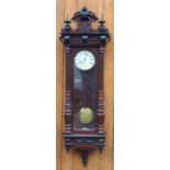 A late 19th century walnut Vienna regulator wall clock,