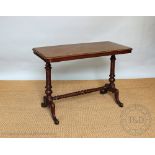 A Victorian walnut stretcher table, on turned uprights and scroll legs,