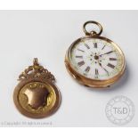 A Continental 9ct gold cased fob watch, with Roman numeral enamel dial and plated movement cover,