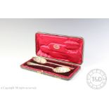 A cased pair of Victorian silver berry spoons, Holland, Aldwinkle and Slater, London 1898,