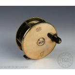 A vintage Hardy brass and alloy 10cm fishing reel, with horn handle,