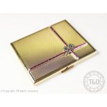 An Art Deco style gold plated powder compact,