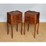 A pair of French inlaid walnut bed side tables, of 18th century design, with three drawers,
