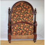 A late 19th century French carved mahogany bed, with high arched head board and shallow foot board,