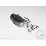 A silver Arts and crafts caddy spoon, Deakin & Francis Ltd, Birmingham 1904,