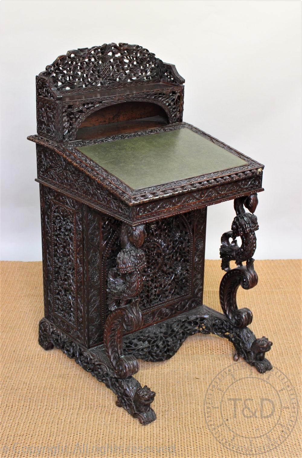 A late 19th century Anglo Indian / Burmese carved hardwood Davenport,
