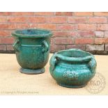 Two Chinese green glazed garden planters, the taller with four lobed handles, 41cm H,