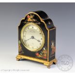 An Elliott chinoiserie lacquered eight day mantle time piece,