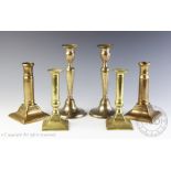 Three pairs of candlesticks, to include; a brass pair, stamped 'W.S PATENT' with a coronet, 16.