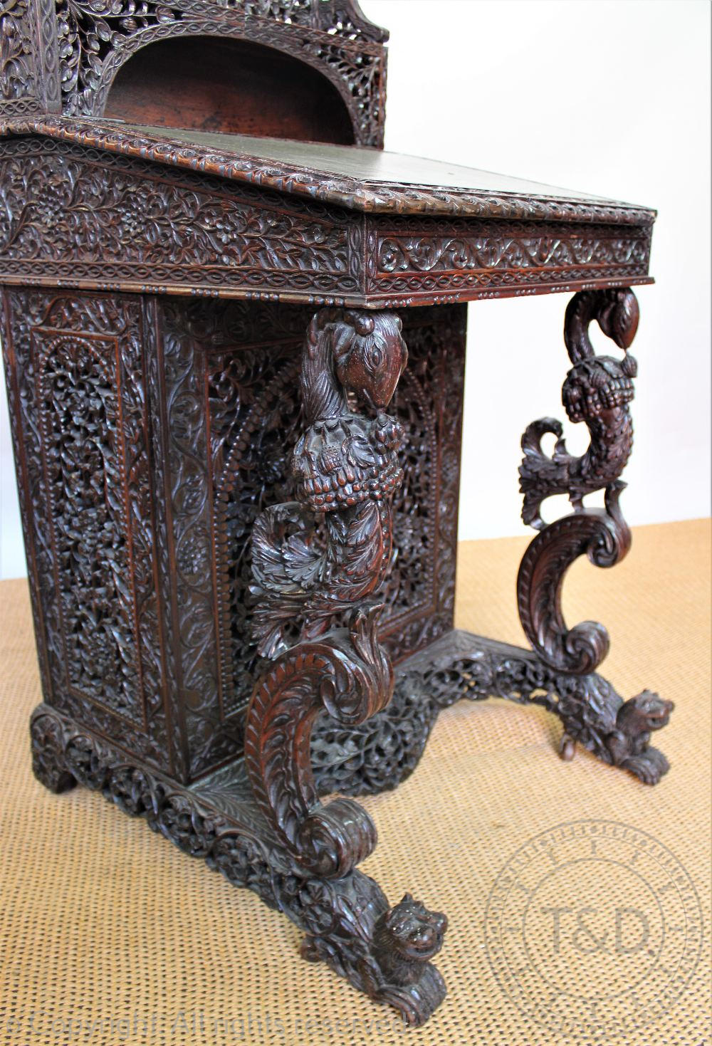 A late 19th century Anglo Indian / Burmese carved hardwood Davenport, - Image 3 of 9