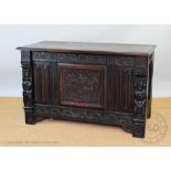 An 17th century style carved oak coffer,