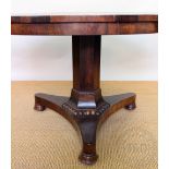 A William IV rosewood breakfast table, with hexagonal column, platform and cusped feet,