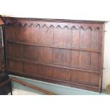 A 19th century and later oak plate rack, with three shelves,