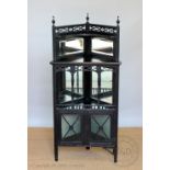 A late 19th century Aesthetic ebonised corner cabinet,