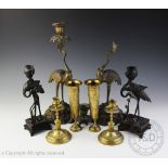 An associated pair of Japanese bronze figural candlesticks,