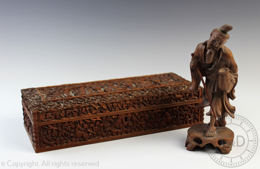 An Indian carved wood glove box,