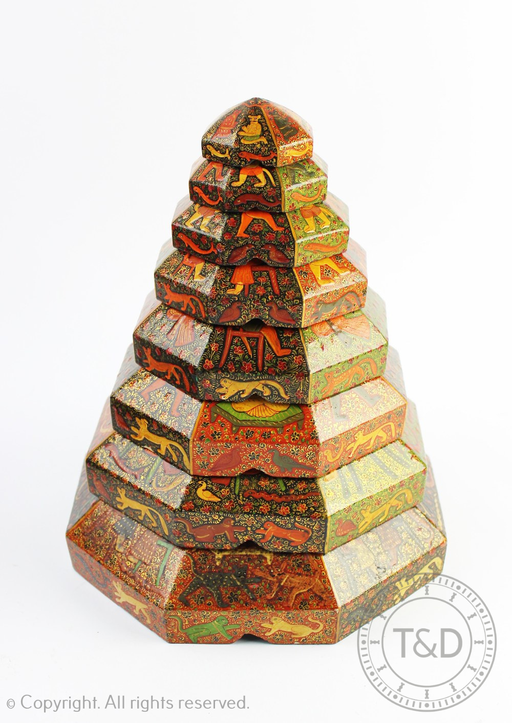An early 20th century Indian lacquered papier mache graduated set of nine octagonal boxes and - Image 3 of 3