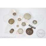 A collection of eleven 18th and 19th century silver coins including Maundy pieces,
