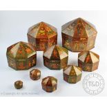 An early 20th century Indian lacquered papier mache graduated set of nine octagonal boxes and