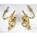 A pair of Louis XV style Rococo wall lights, gesso and gilt wood, each with twin acanthus branches,