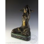 A bronzed figure of a female dancer in the style of D H Chiparus,