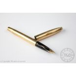 A 9ct yellow gold cased Sheaffer fountain pen, London 1970, with engine turned detail throughout,