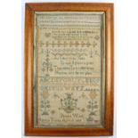 A Victorian needlework sampler by Bessey Wood aged 9, and dated April 19th 1839 / 1889?,