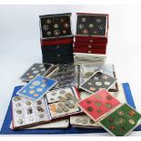 A collection of ten Royal Mint decimal proof sets, in blue and red folders,