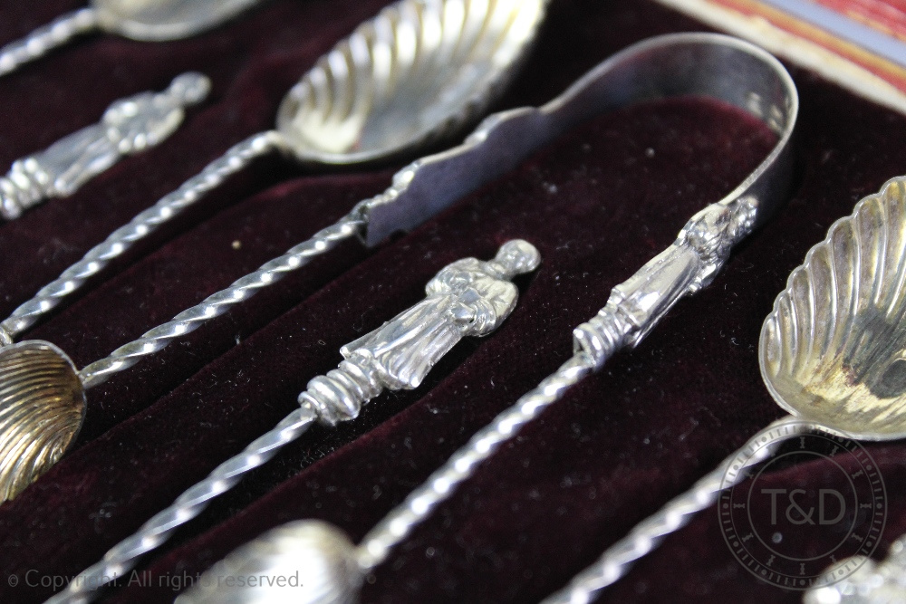 A cased set of six silver teaspoons, sugar nips and sugar sifter, Charles Boyton, London 1895, - Image 2 of 2