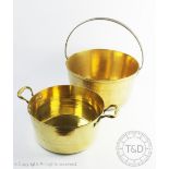 A large brass cooking pot, 19th century with wrought iron handle, 43cm high,