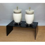 A pair of cream and craquleure glazed lamp bases,