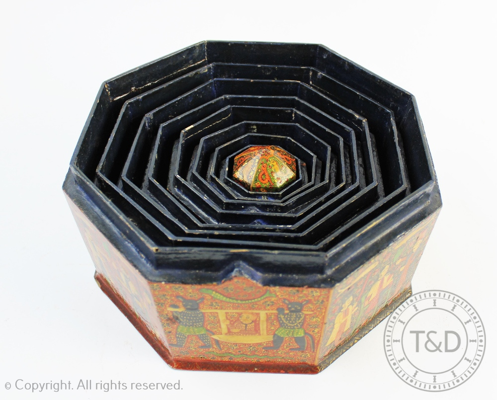 An early 20th century Indian lacquered papier mache graduated set of nine octagonal boxes and - Image 2 of 3