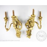 A pair of Louis XV style Rococo wall lights, gesso and gilt wood, each with twin acanthus branches,