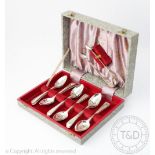 A set of twelve silver Old English and Bead pattern teaspoons and sugar tongs,
