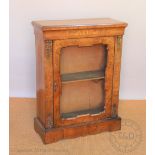 A Victorian marquetry inlaid walnut pier cabinet, with glazed door enclosing shelves,