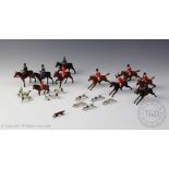 A Britains cold painted lead hunting series comprising, three ladies riding side saddle,