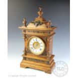 A late 19th century oak eight day mantel clock,